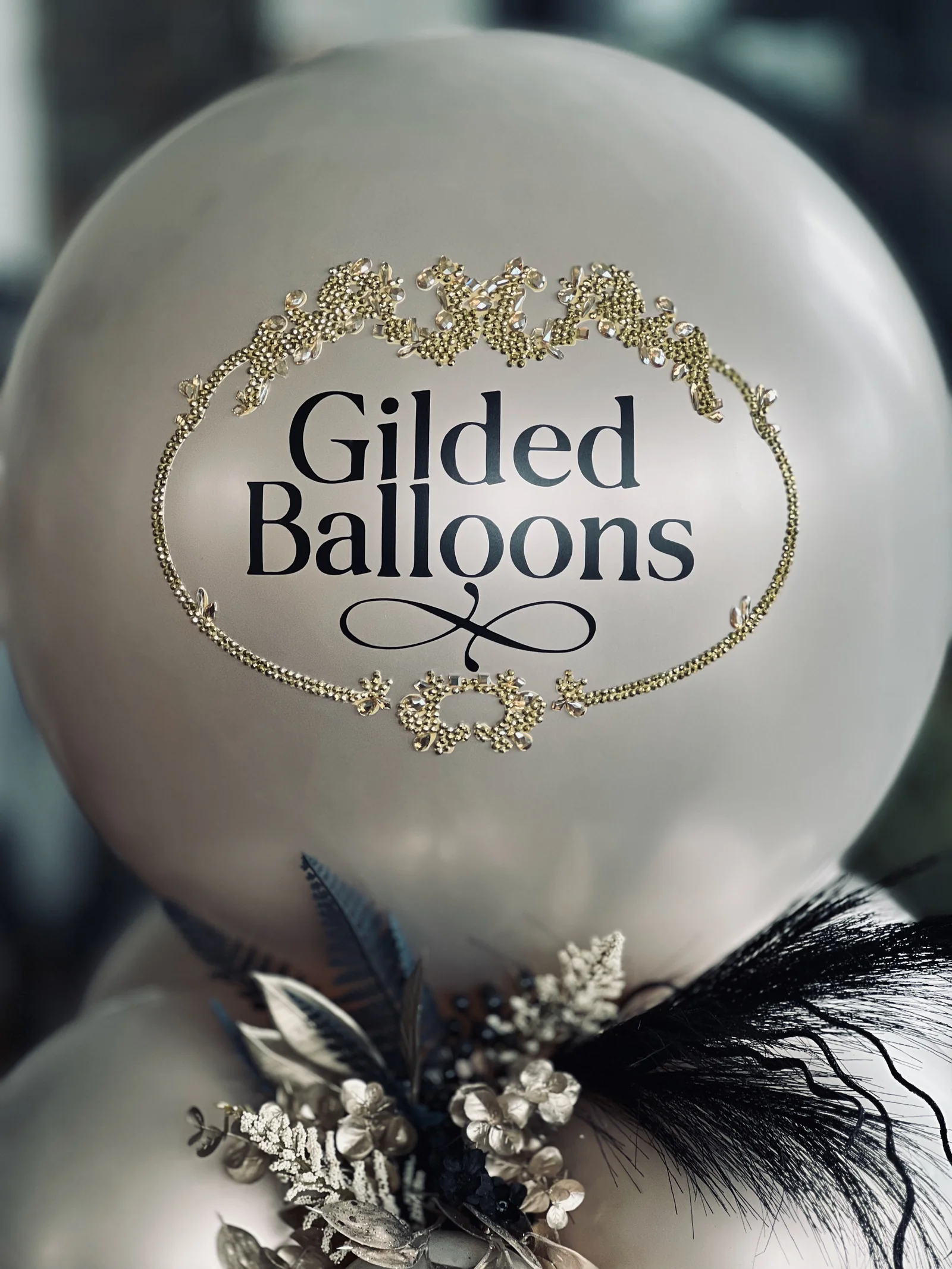 A refined balloon arrangement with a custom filigree detail